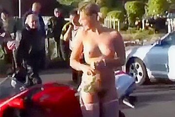 A hot older chick goes walking outside undressed
