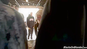 Amazing blonde lady with big, firm boobs is sucking many black dicks in a row