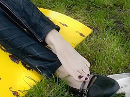 Beautiful Zoe shows her sexy feet at the lake