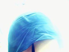 Big ass brunette standing in the city while getting filmed upskirt