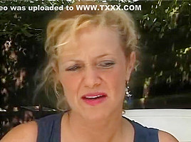 Blonde MILF stripping outside