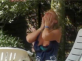 Blonde MILF stripping outside