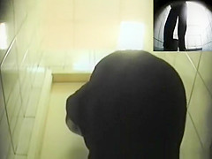 Blonde woman pissing in toilet