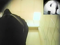 Blonde woman pissing in toilet