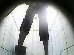 Blonde woman pissing in toilet