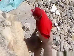 Blowjob and fuck in rocky seashore