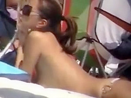 Boobalicious babe at beach topless