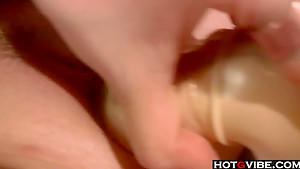 Busty redhead uses a vibrator on her hole