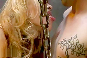Chained guy fucked by busty tranny