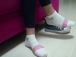 Chinese footjob with socks on pants