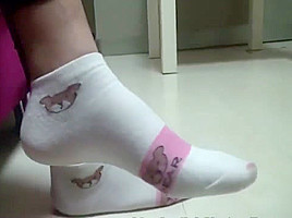 Chinese footjob with socks on pants