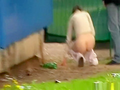 Couple caught peeing together