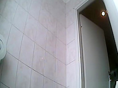 Cute chick peeing in toilet
