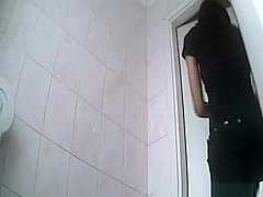 Cute chick peeing in toilet