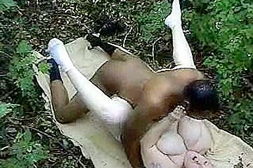 Fat woman taking a big black cock in the woods