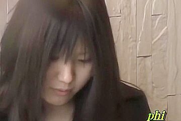Feisty young Japanese slut holding her phone during sharking adventure