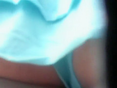 Hot girl in a turqoise short skirt