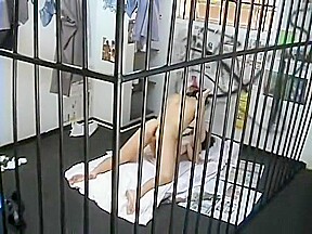 Hot redhead Cristine has a prison guard banging her holes behind bars