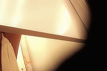 Hottie from changing room sex video flashes pantieless butt