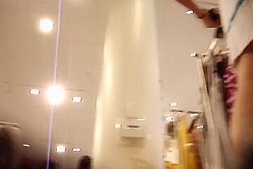 Hottie from changing room sex video flashes pantieless butt