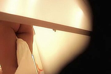 Hottie from changing room sex video flashes pantieless butt