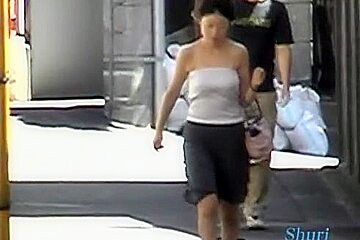 In this asian sharking video a guy pulls of the shirt of a sexy woman