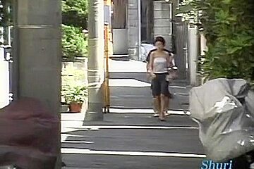 In this asian sharking video a guy pulls of the shirt of a sexy woman