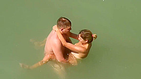 Kama Sutra on the beach Couples have sex in the sea