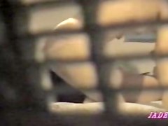 Lesbian babes have fun in video made through window