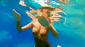 Nastka peeing into the sea