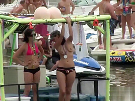 Naughty brunette strips at the beach