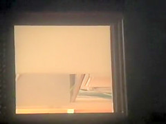 Nude girl spied from the window