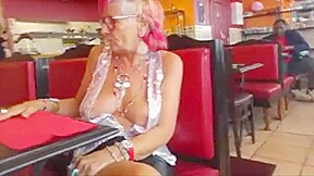 Old woman showing off her big chest
