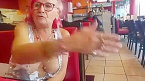 Old woman showing off her big chest