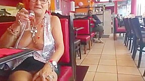 Old woman showing off her big chest