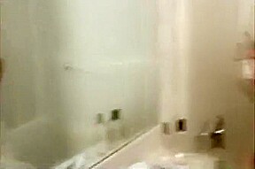 Petite cutie with huge natural tits showering and masturbating
