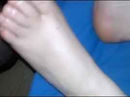 Rubbing her soles (cum)