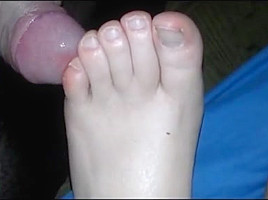Rubbing her soles (cum)