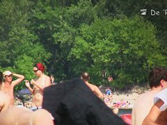 Semi nude, semi-regular beach with naked and dressed people