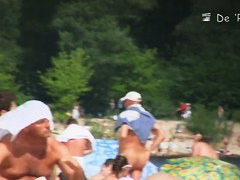 Semi nude, semi-regular beach with naked and dressed people