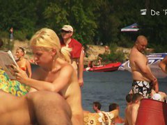 Semi nude, semi-regular beach with naked and dressed people