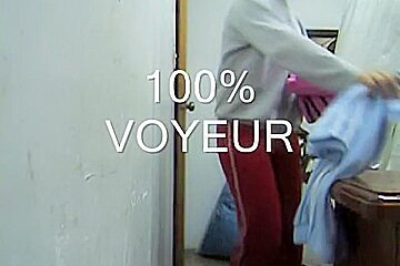 Sexy butted girl cannot decide what pants to put on