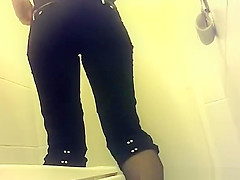 Short pants woman peeing in public toilet