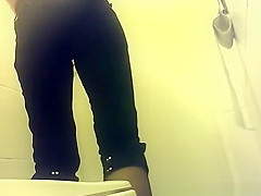 Short pants woman peeing in public toilet