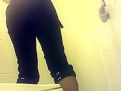 Short pants woman peeing in public toilet