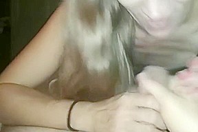 Stepmom jerks off cock with legs and sticks her tongue under the foreskin
