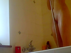 Tattooed girl in the shower