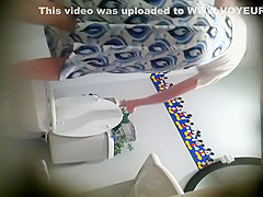 Thin woman secretly examined in a toilet