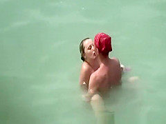 Two nudist couples fucking in the water
