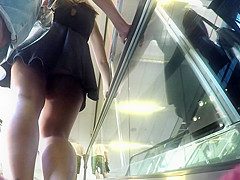 Upskirt of girl with black dress and boyfriend